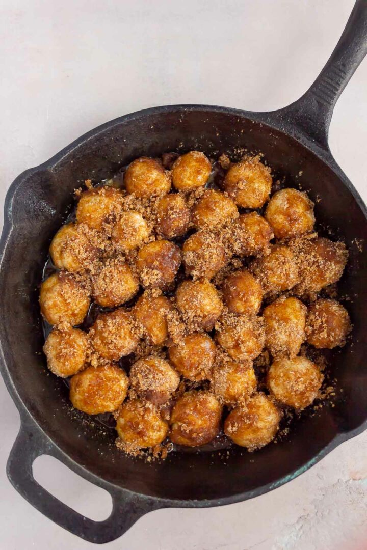 monkey bread in a cast iron skillet before being baked