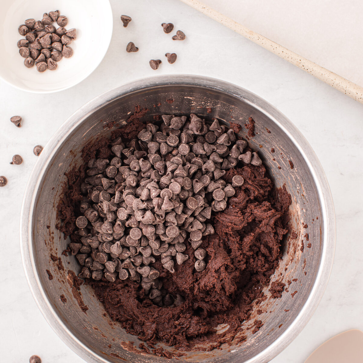 cookie batter mixed in with chocolate chips
