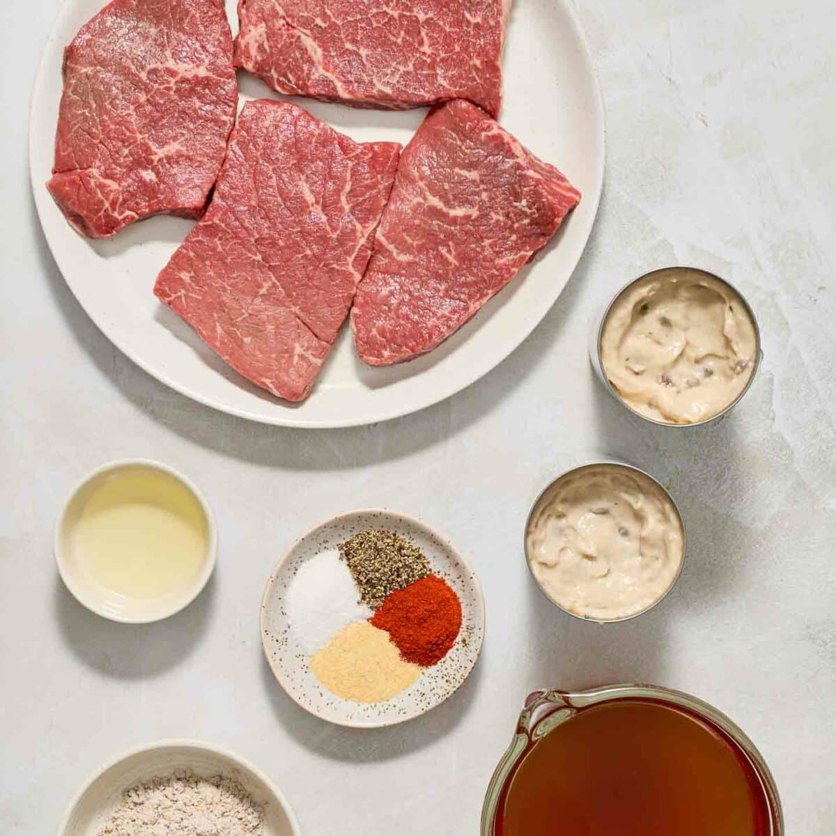 round steak ingredients in white bowls