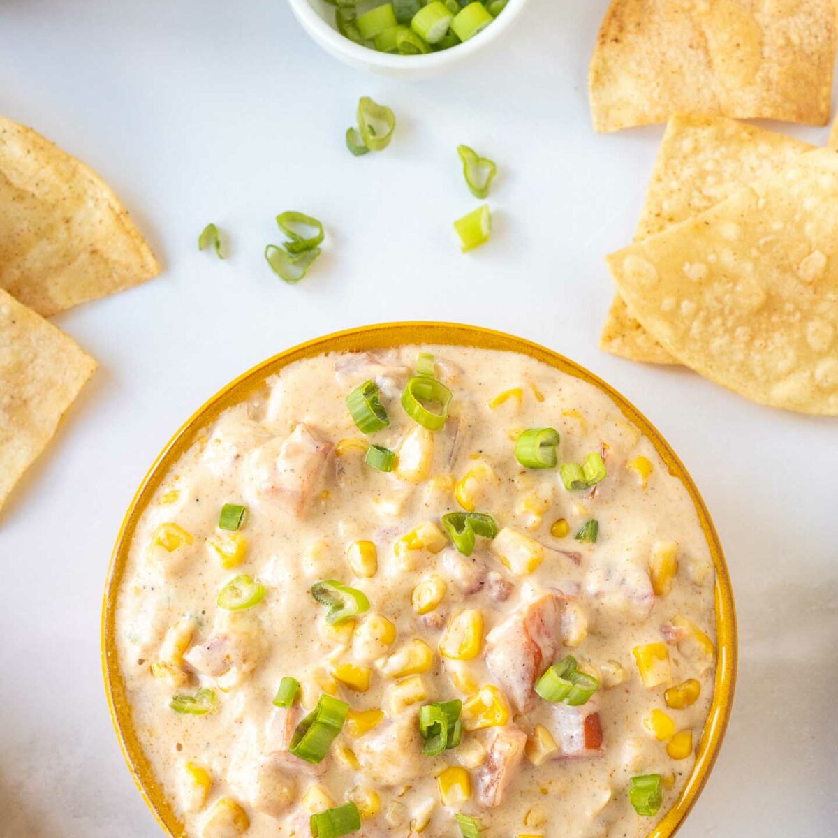 corn dip in a brown bowl