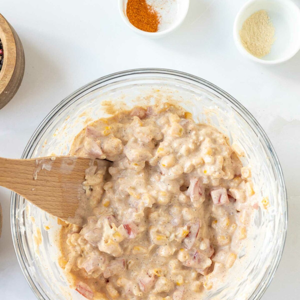 corn dip ingredients mixed in a glass bowl