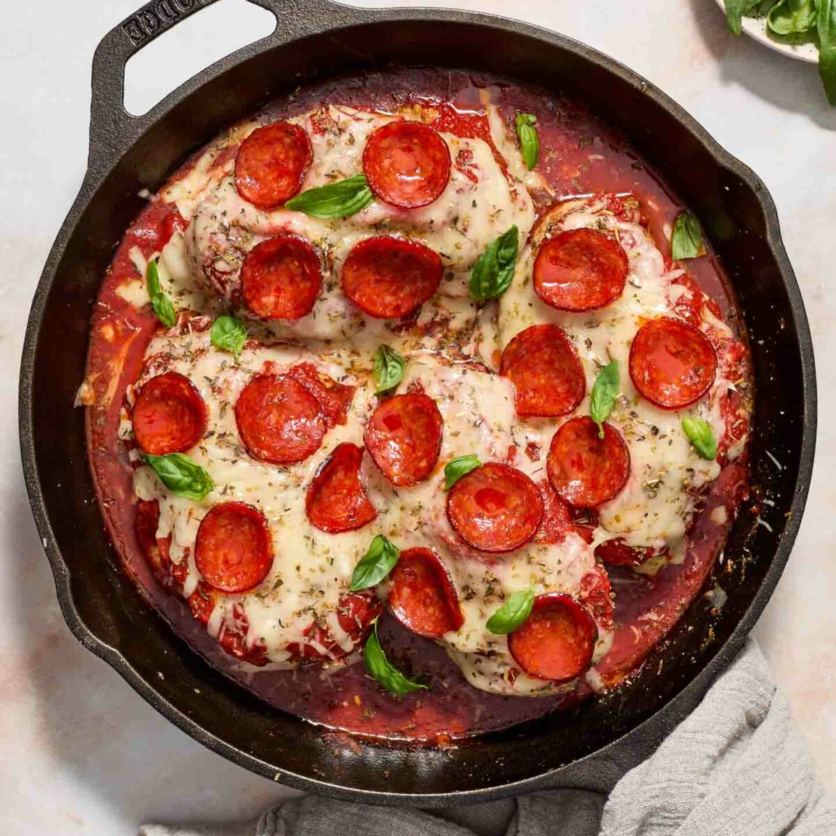 pizza chicken in a black skillet