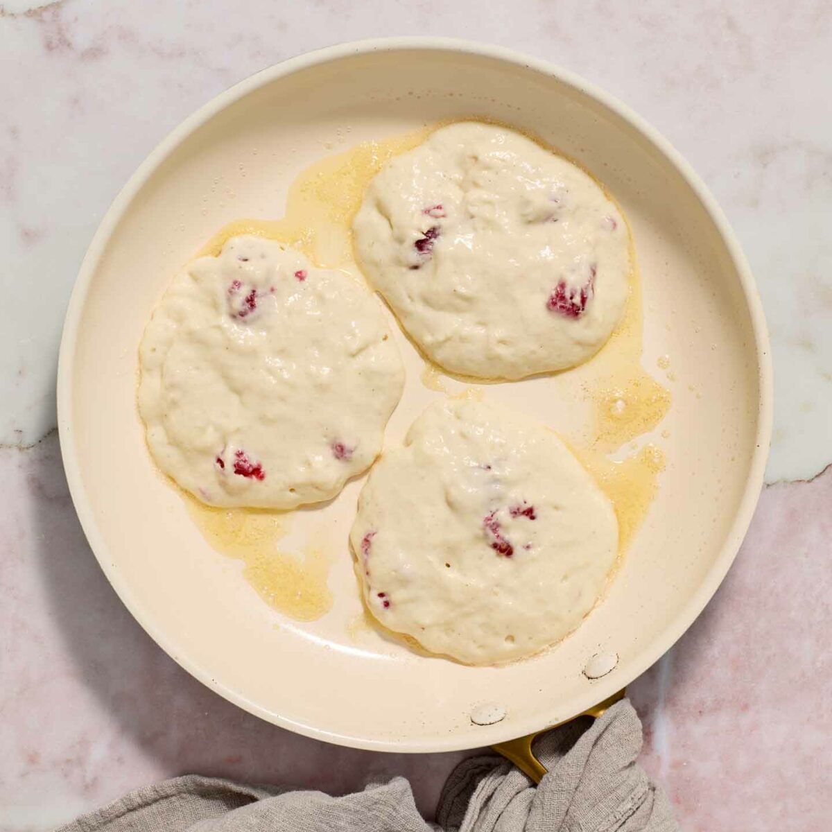 pancake batter in a white skillet