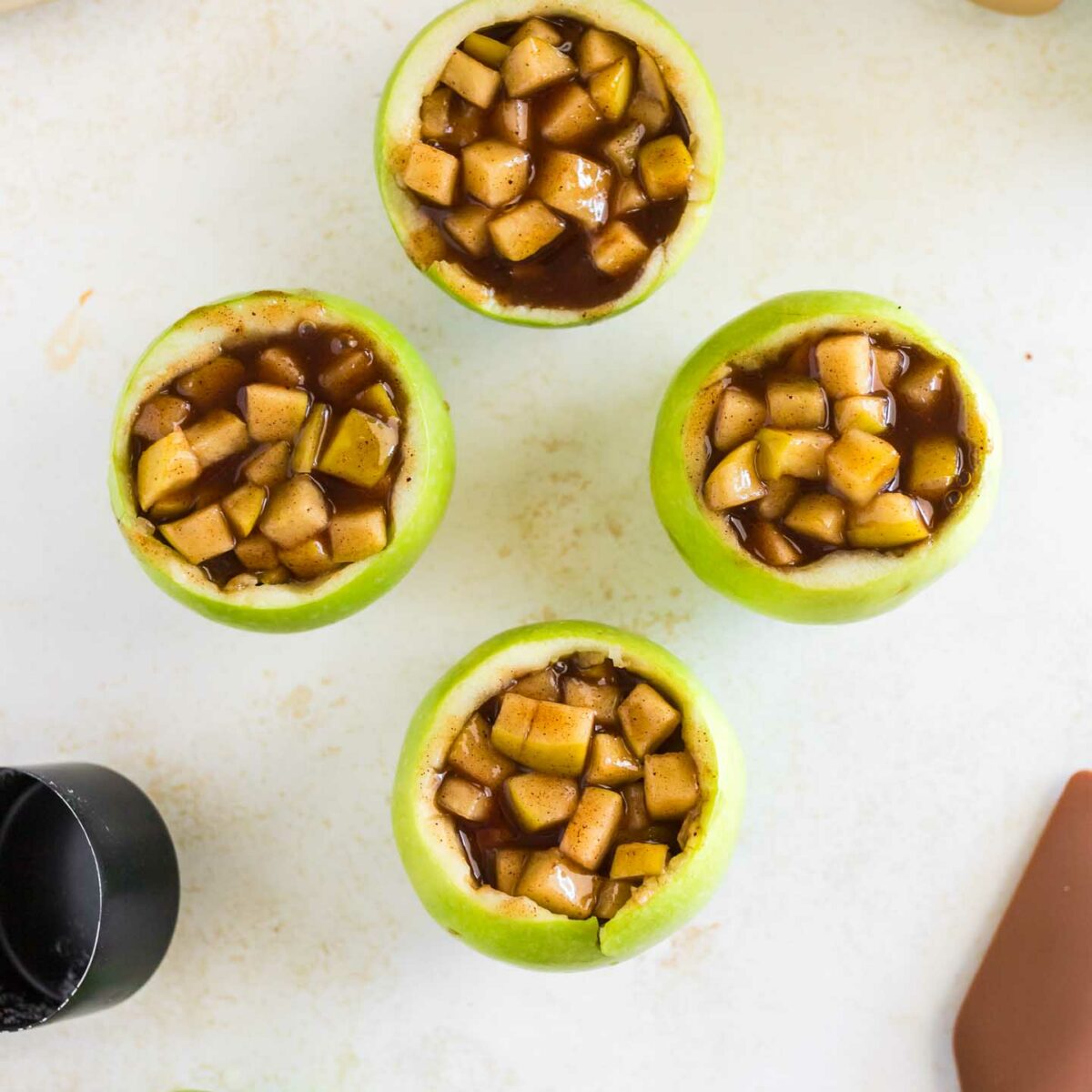 apple filling in four hollowed apples