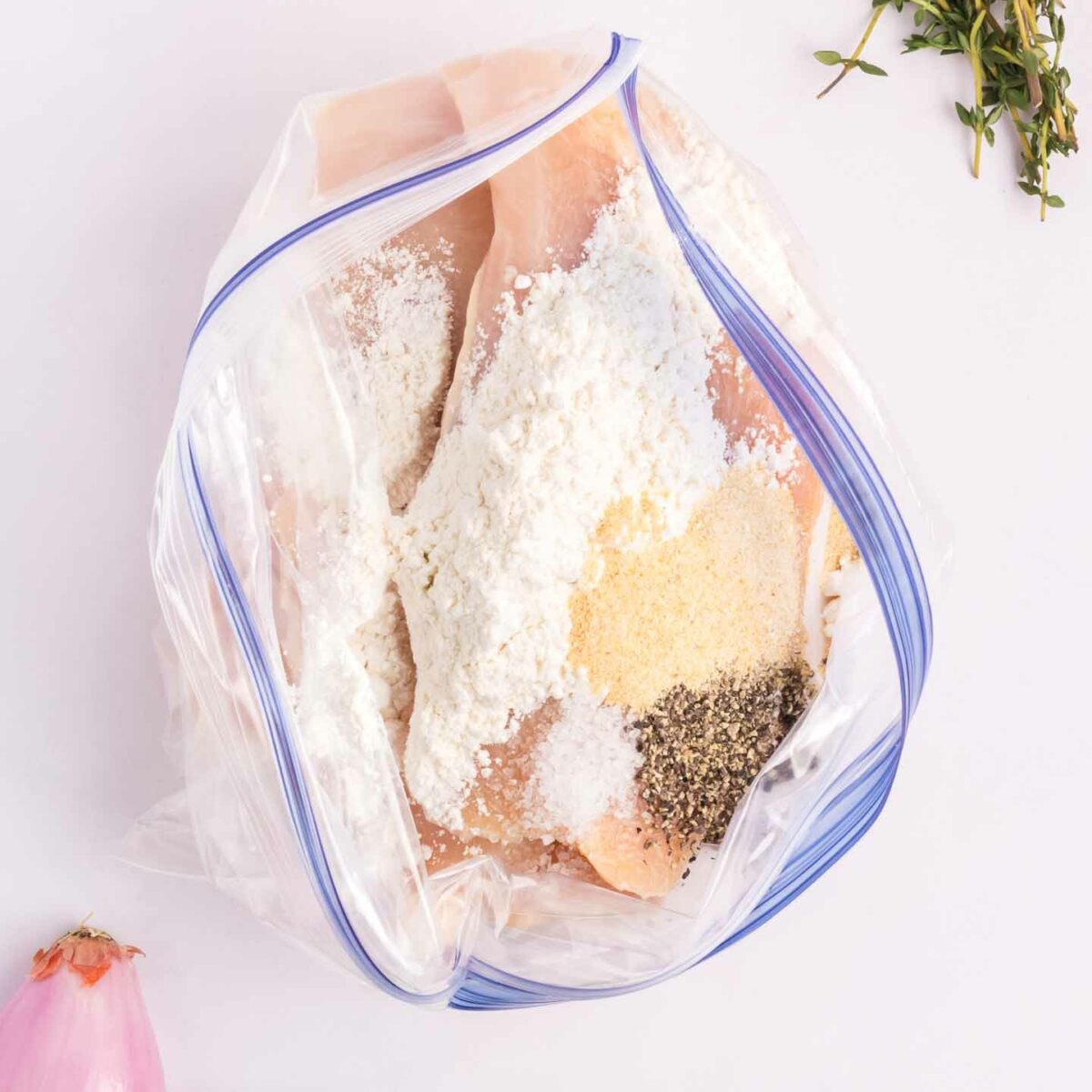 ingredients in a resealable bag with chicken