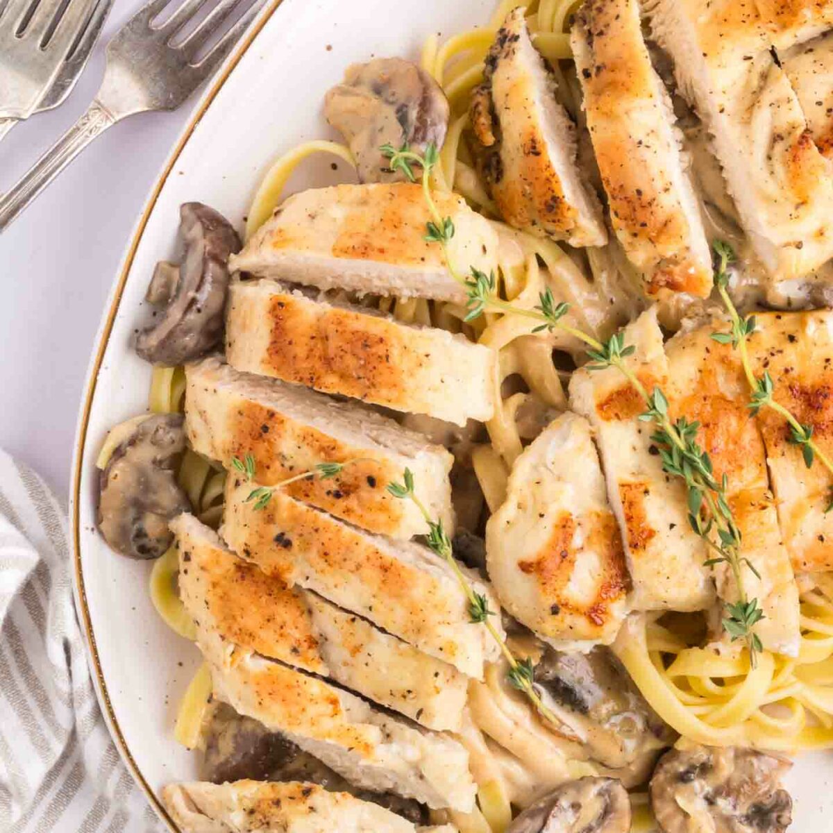 chicken masala pasta on a white serving platter