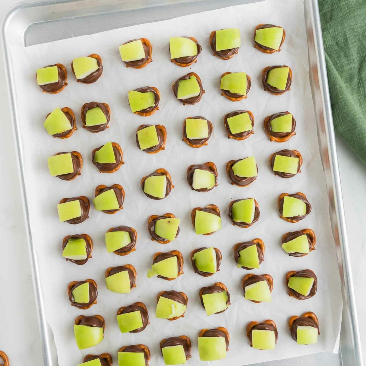 apple pretzel bites fully assembled on a baking pan