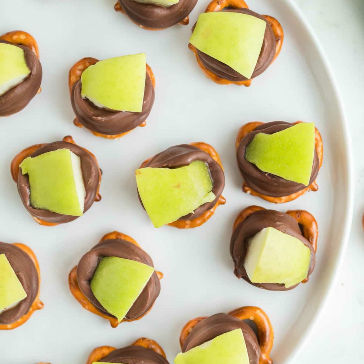 apple pretzel bites on a white plate