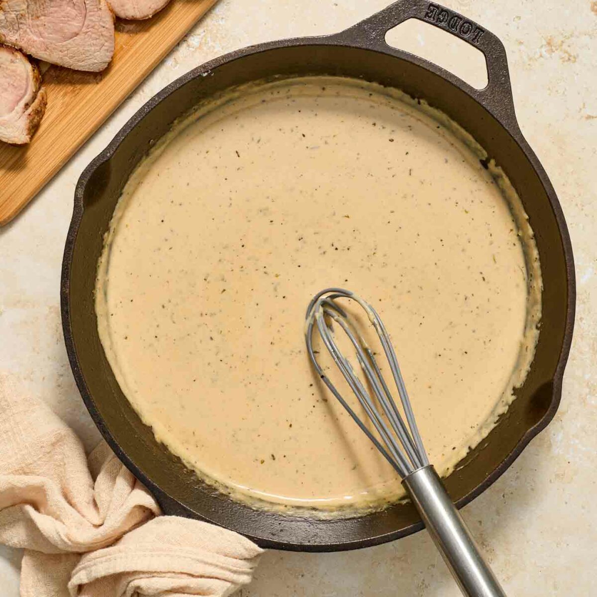 cream sauce in black skillet
