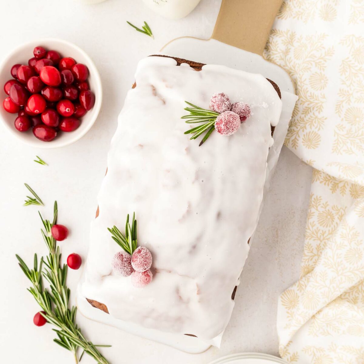 loaf with icing on a white platter