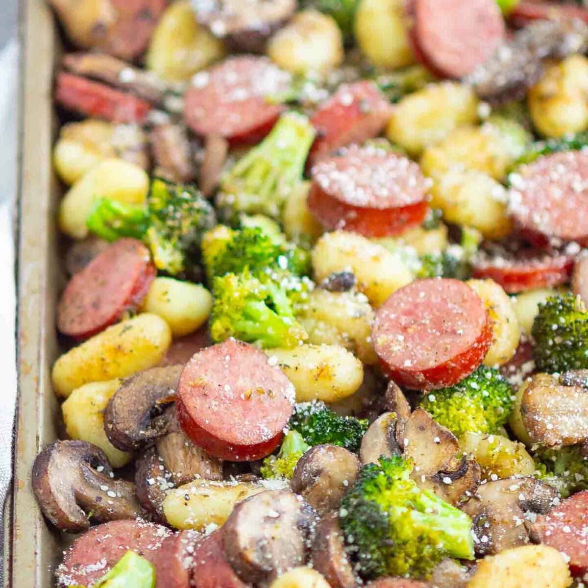sausage, gnocchi, broccoli, mushrooms on a sheet pan