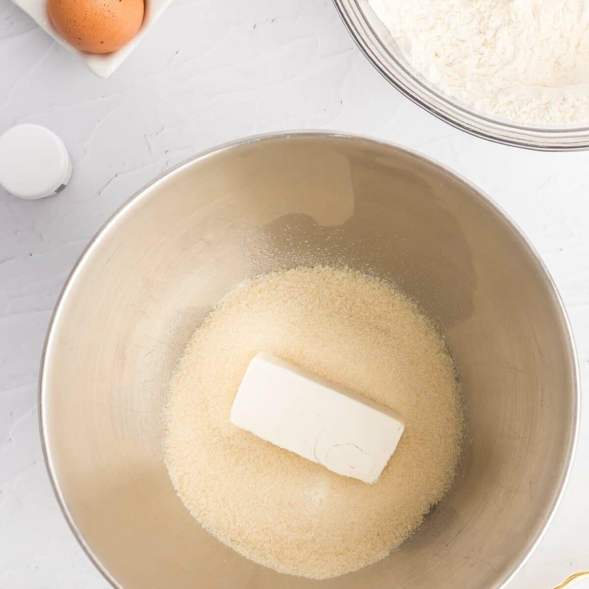 butter and sugar in a metal mixing bowl
