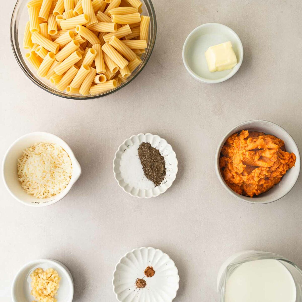 pumpkin alfredo pasta ingredients in small white bowls
