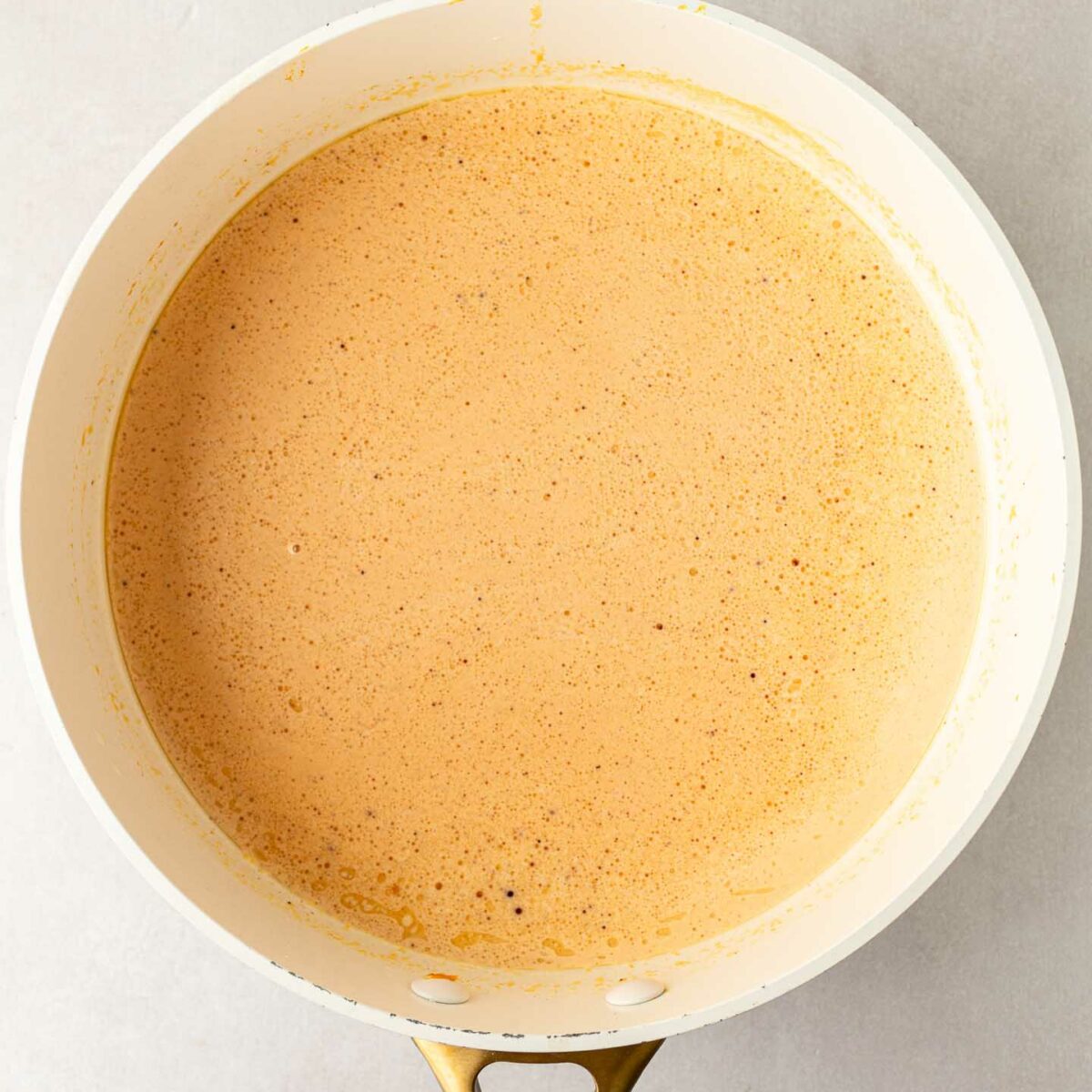 pumpkin alfredo sauce in a white skillet