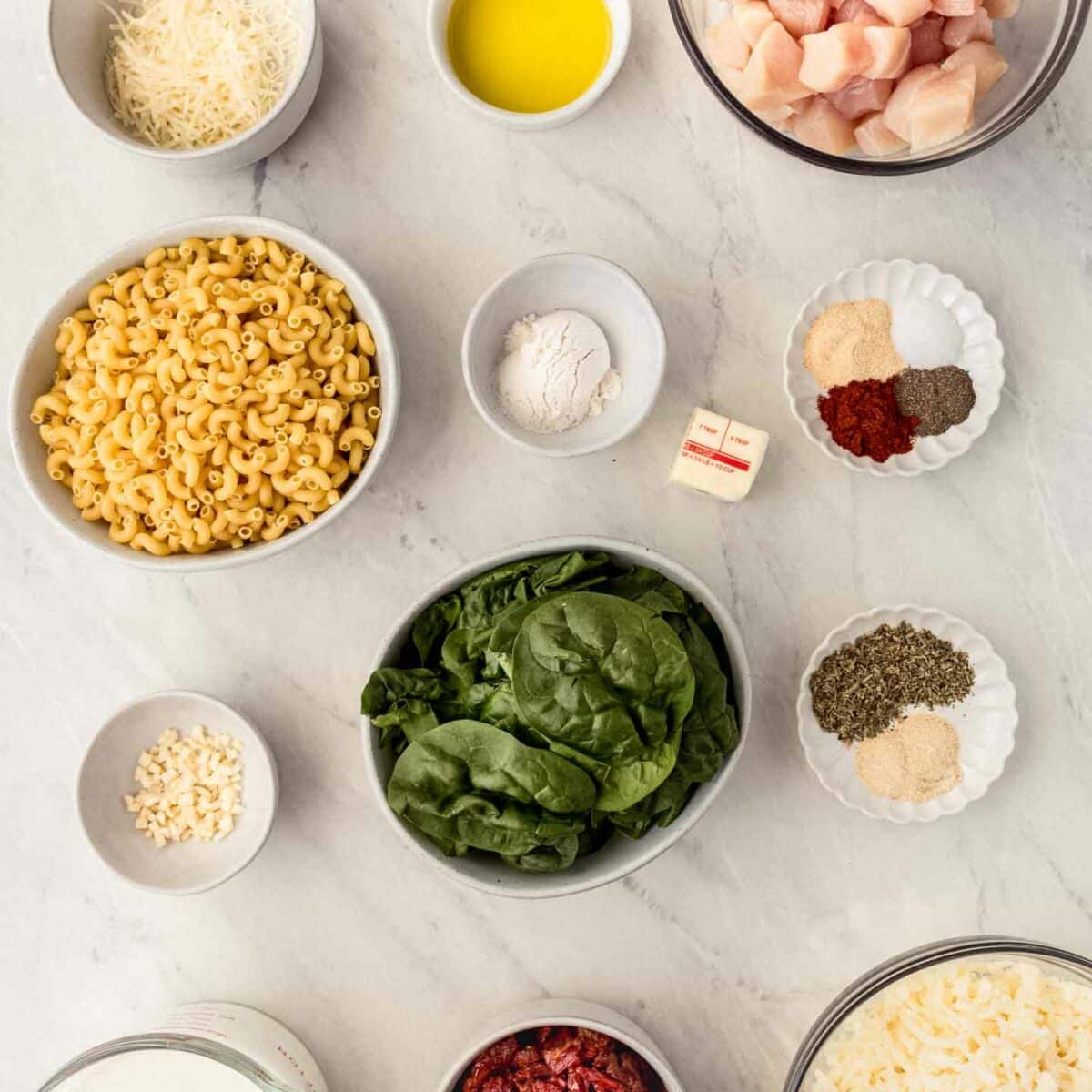 chicken mac and cheese ingredients in small white bowls