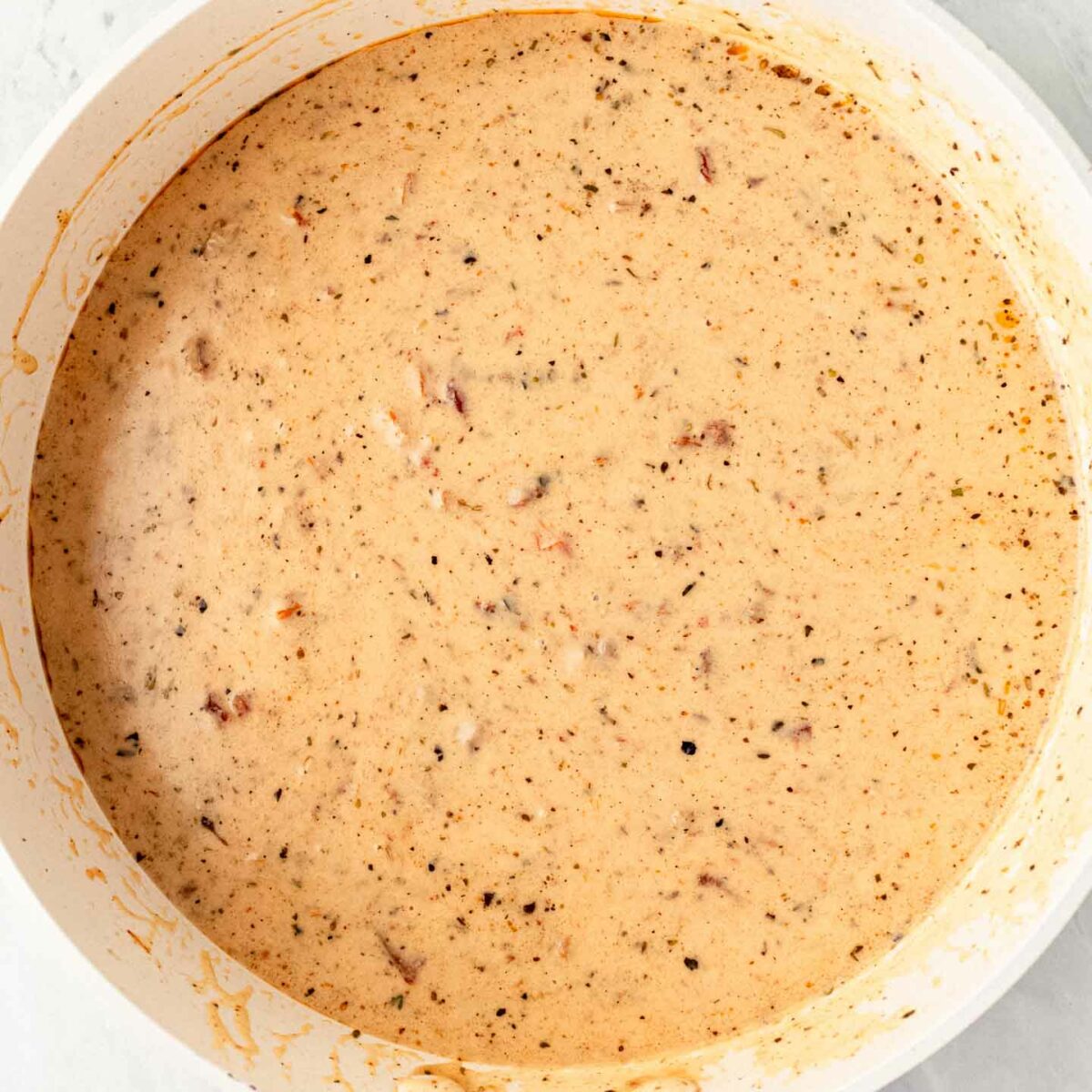 cream sauce in a white skillet