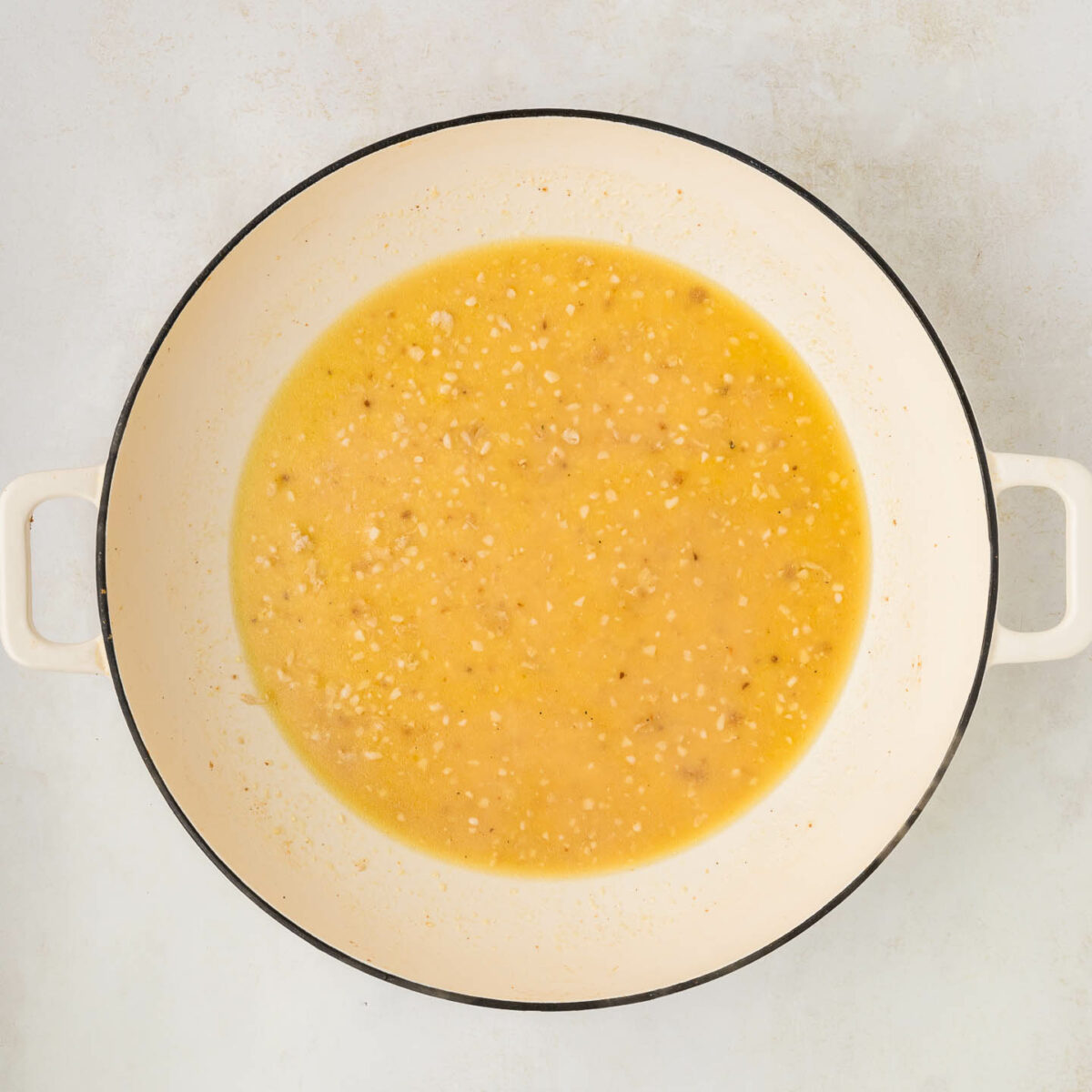sauce ingredients in a white skillet