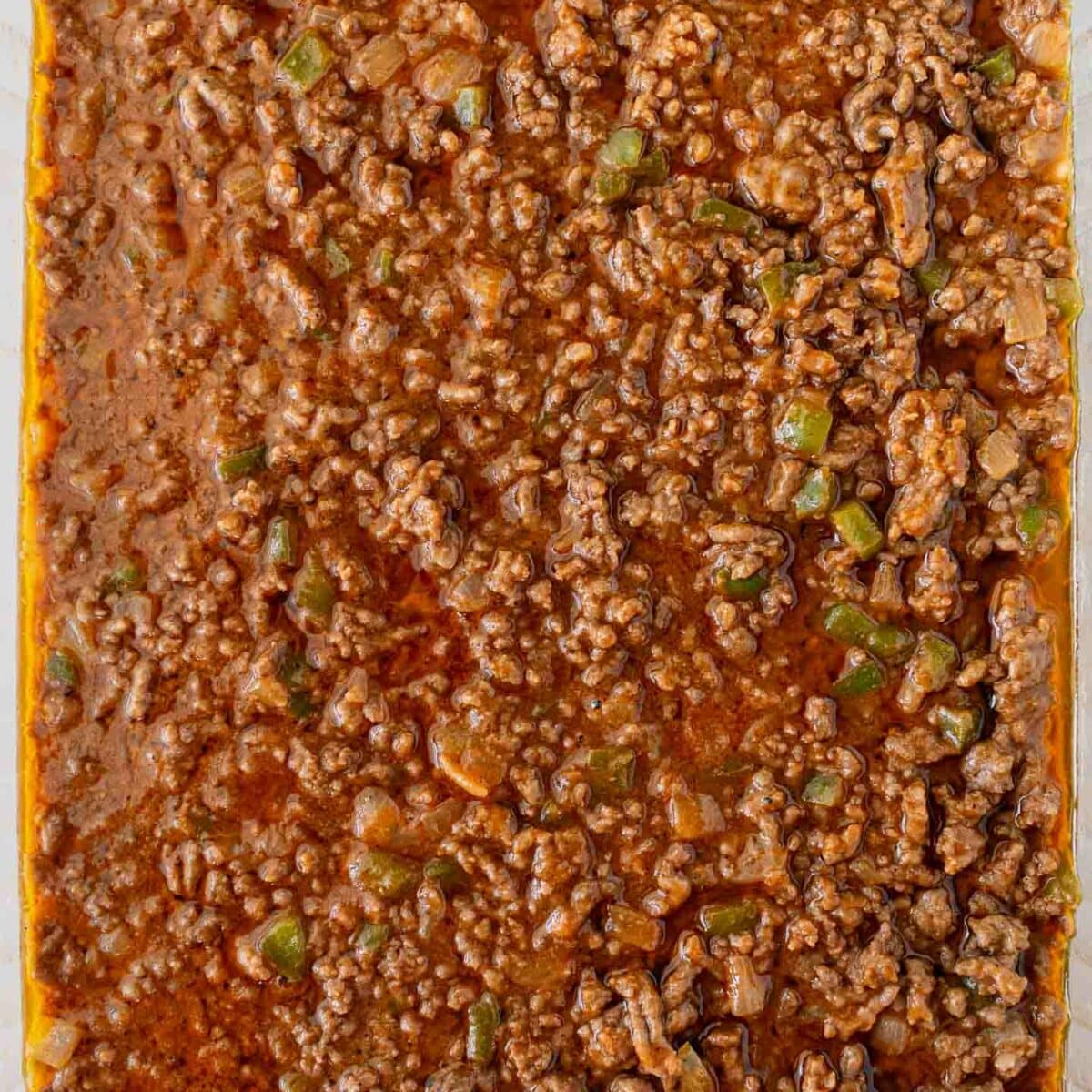 ground beef mixture spread in a baking dish