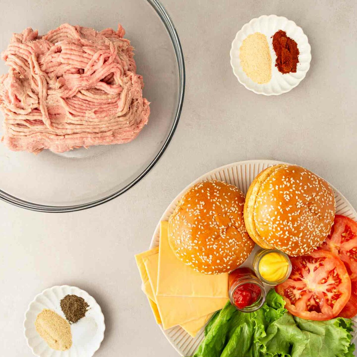 turkey burger ingredients in bowls and on a plate