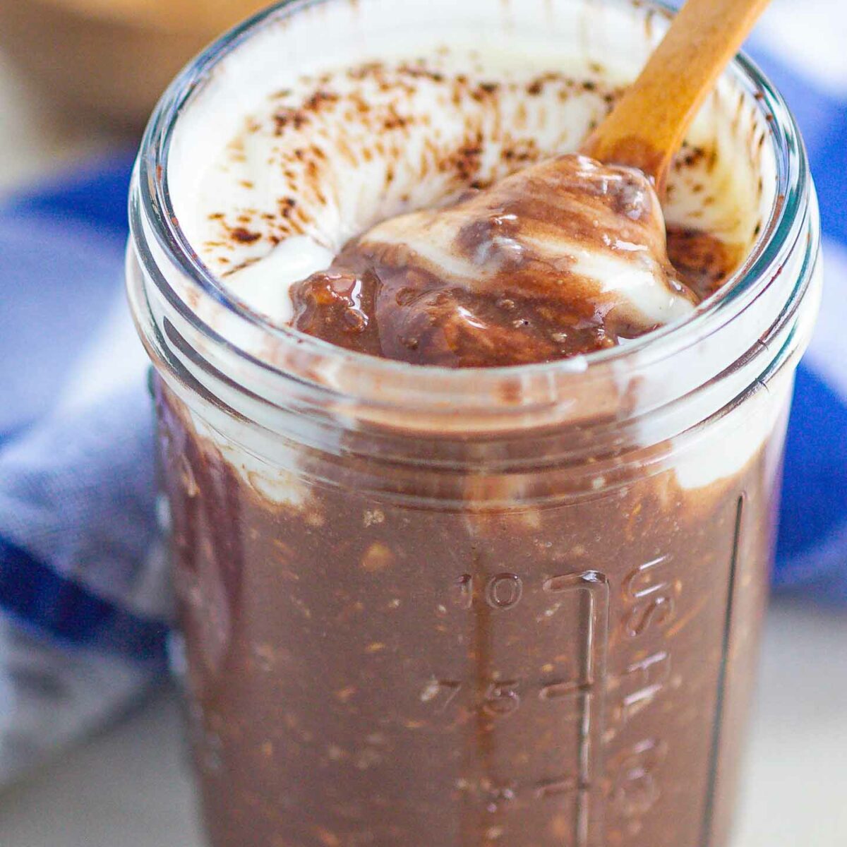 overnight oats with a spoonful of oats showing in a glass jar