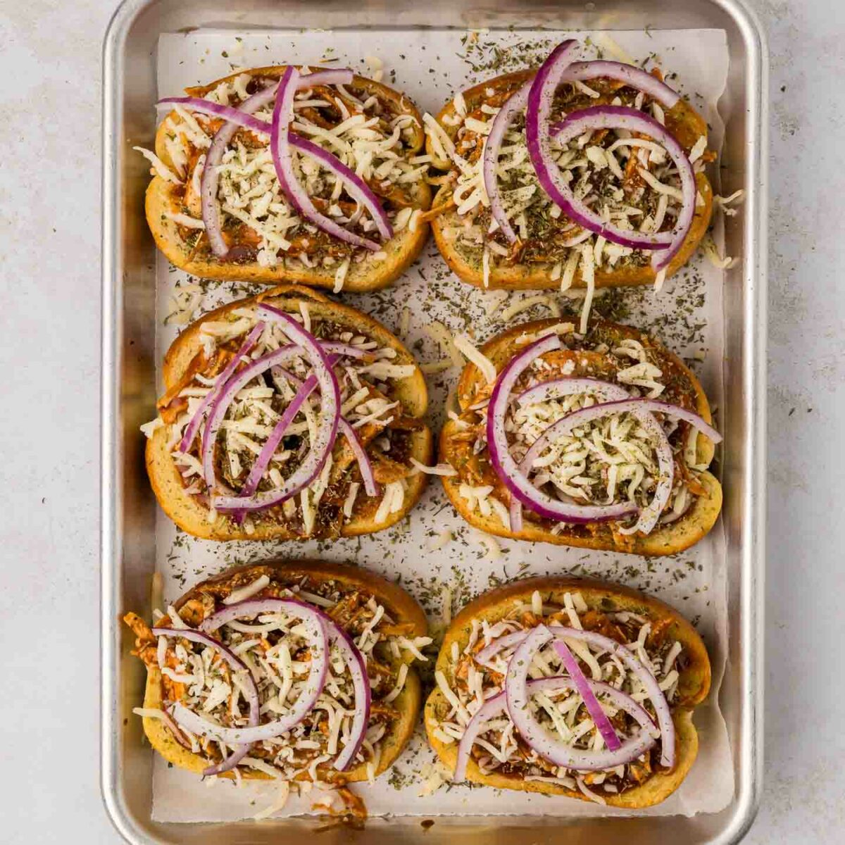 chicken, shredded cheese and onions added to toast