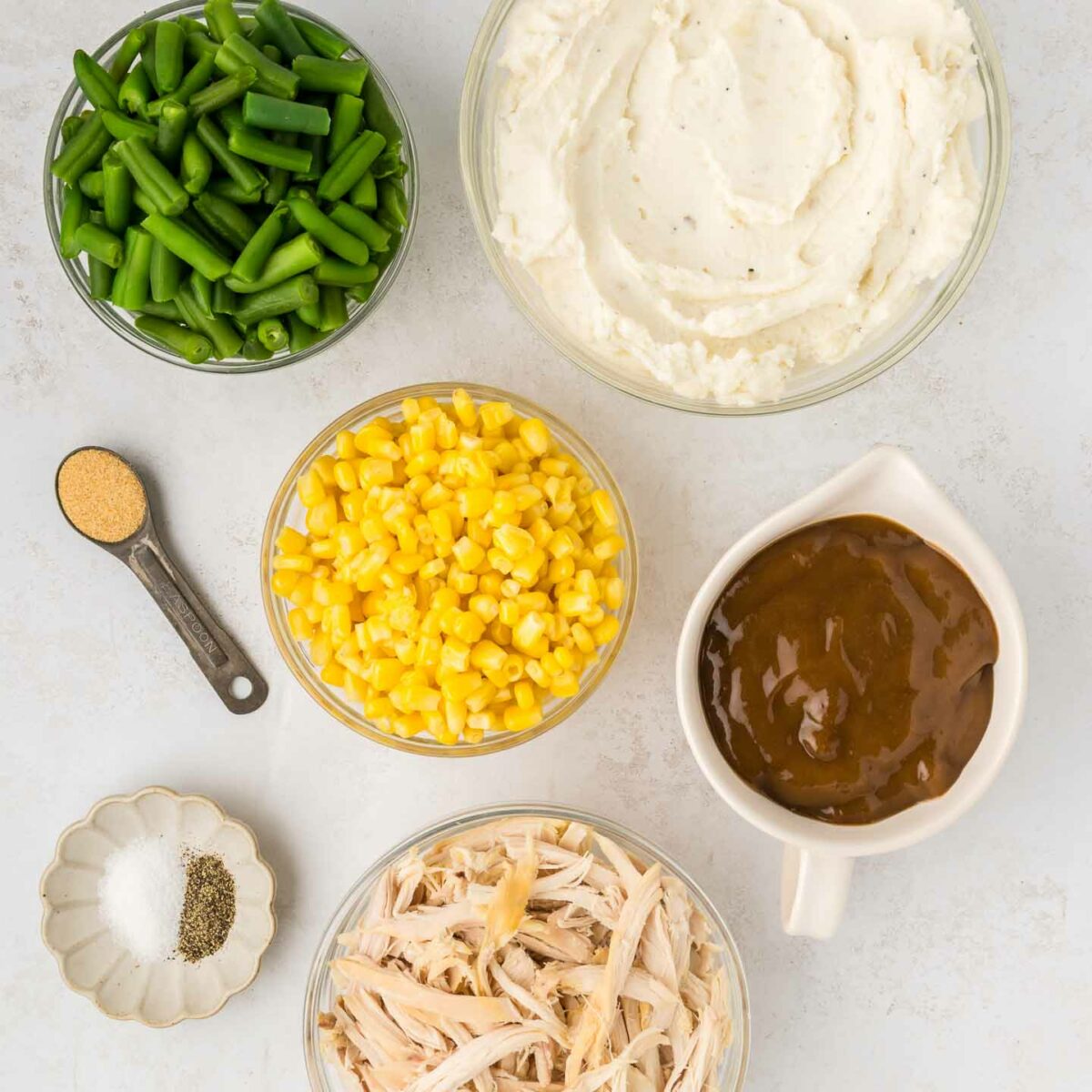 casserole ingredients in clear bowls