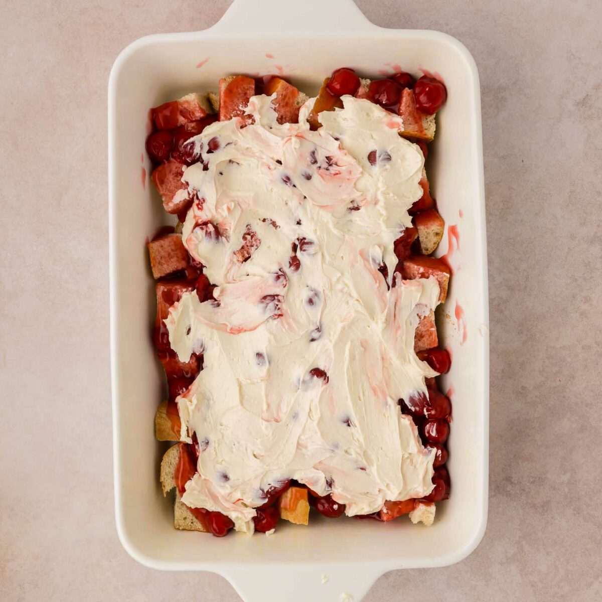 cream cheese mixture spread over the top of pie filling