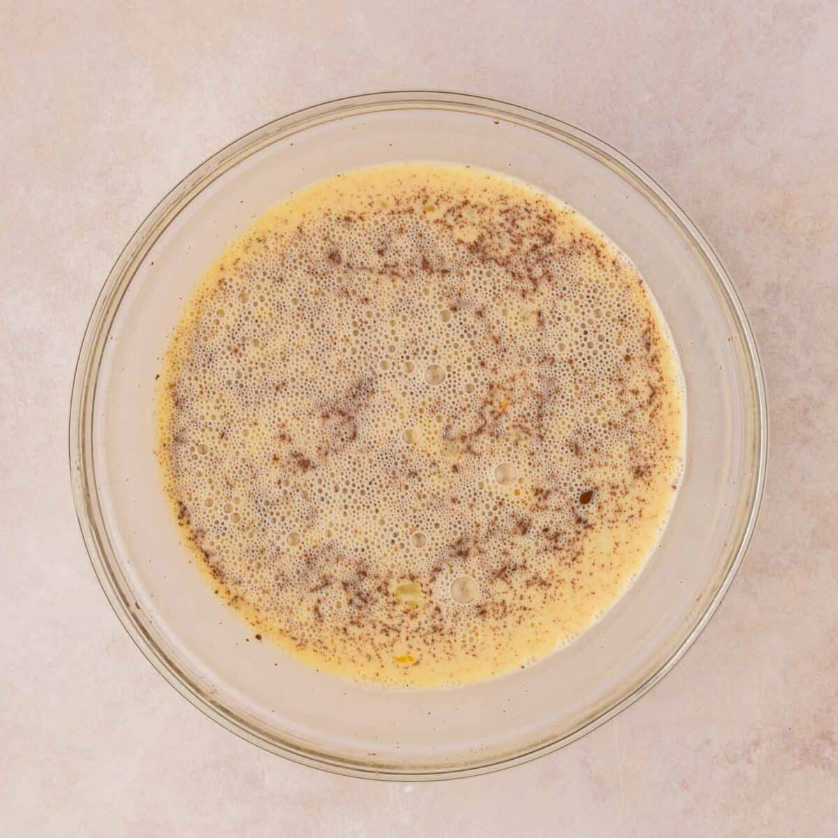 egg mixture whisked in a glass bowl