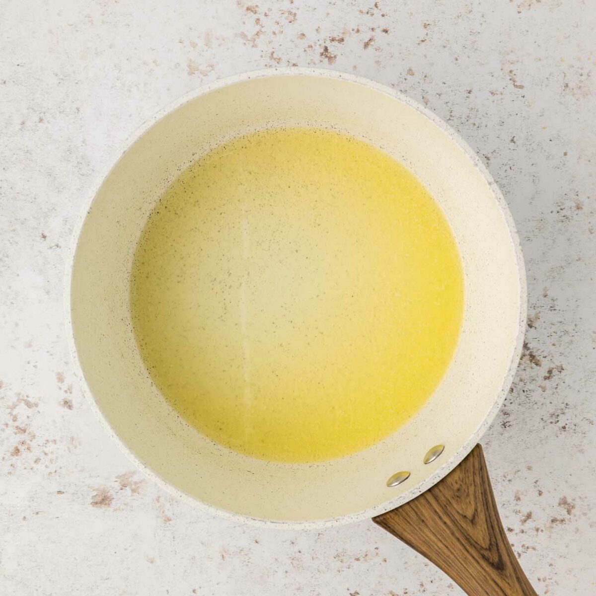 butter and flour shown in a white saucepan