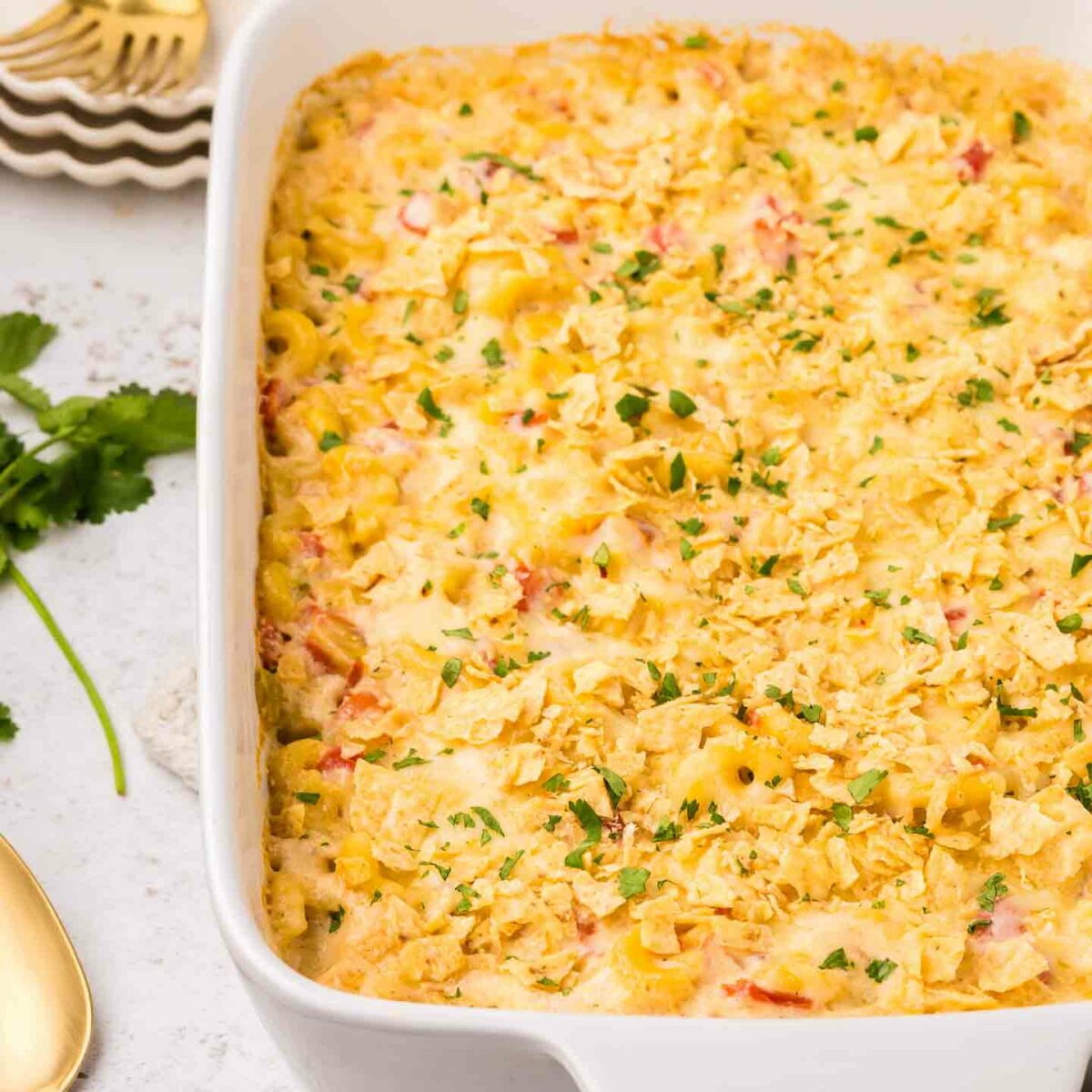 mac and cheese shown in white baking dish