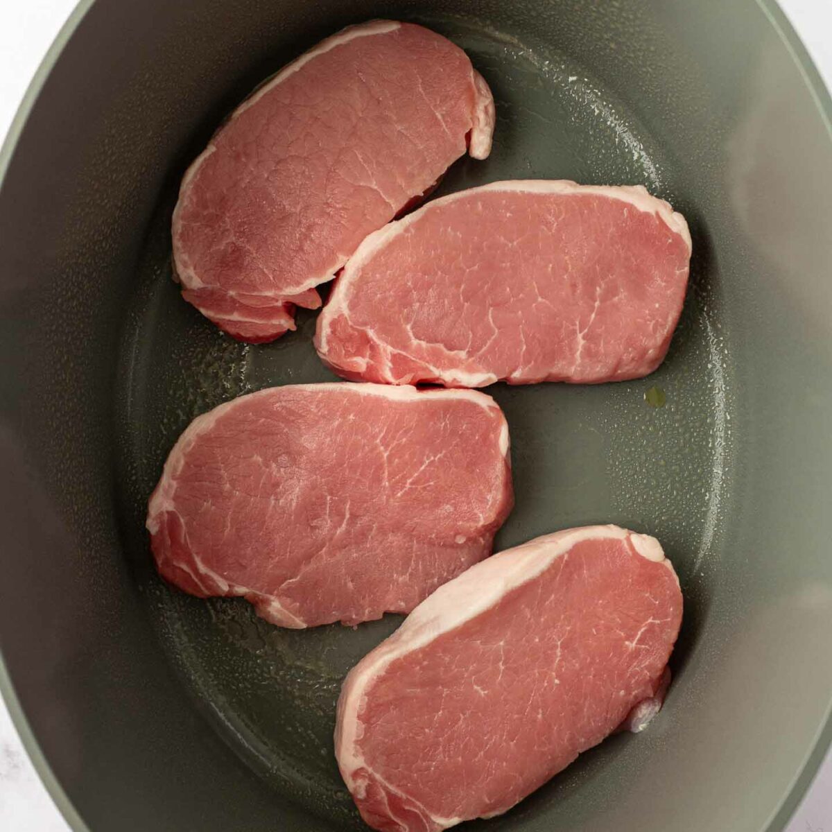 pork chops on the bottom of slow cooker