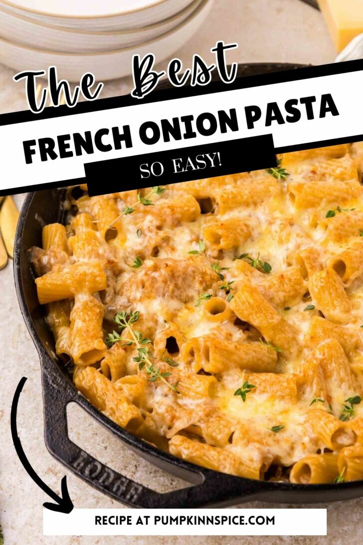 A skillet filled with rigatoni pasta topped with melted cheese and fresh thyme. Text overlay reads: The Best French Onion Pasta, So Easy! Recipe at pumpkinnspice.com.