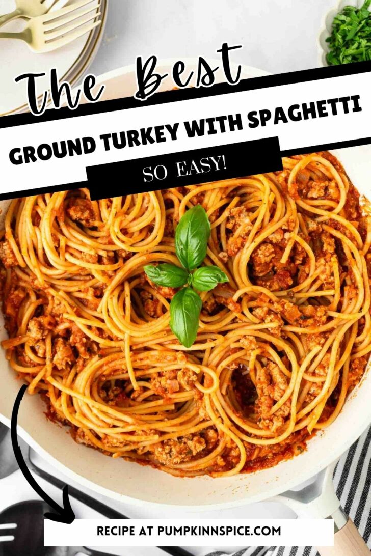 A skillet filled with spaghetti and ground turkey in tomato sauce, garnished with fresh basil leaves. Text reads: The Best Ground Turkey With Spaghetti. So Easy! Recipe at pumpkinnspice.com.