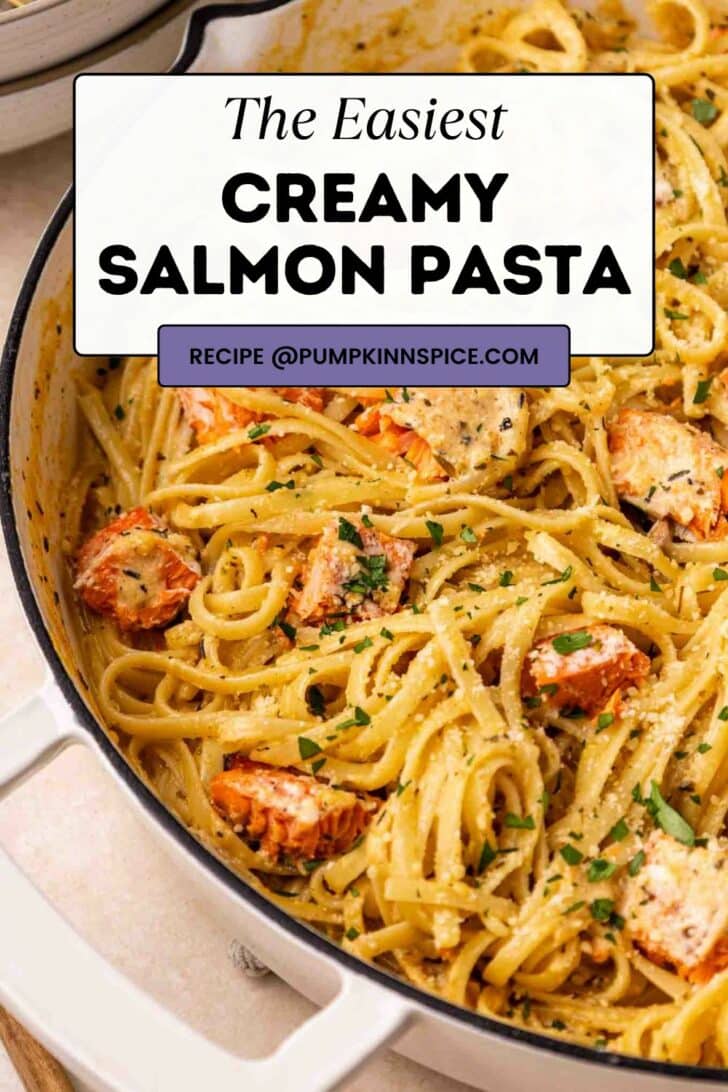 A close-up of creamy salmon pasta in a large white pan, garnished with chopped parsley. A text overlay reads “The Easiest Creamy Salmon Pasta” with a recipe source at pumpkinspice.com.