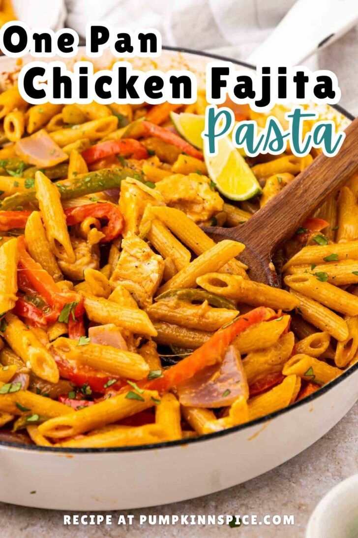 A skillet filled with penne pasta, chicken pieces, bell peppers, and onions in a flavorful sauce, with a wooden spoon stirring the dish. Text on the image reads “One Pan Chicken Fajita Pasta.”.