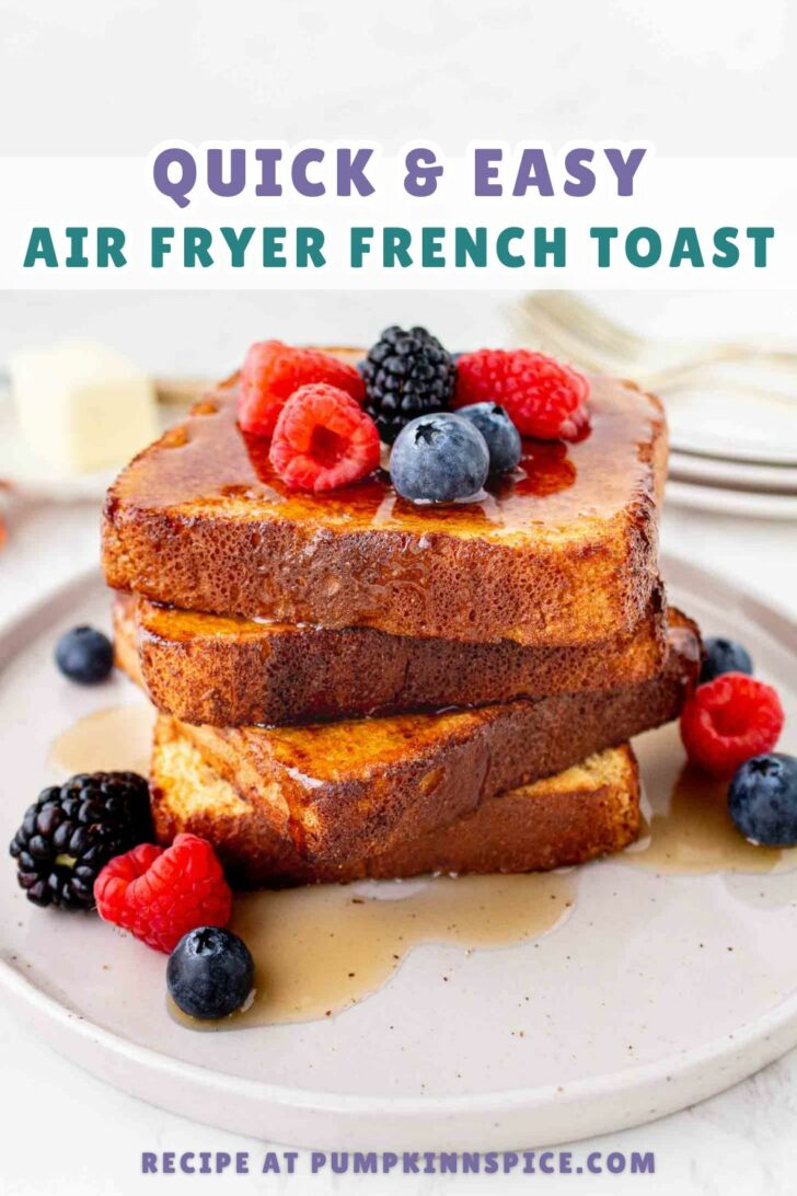 A stack of three slices of French toast topped with fresh raspberries, blueberries, and blackberries, drizzled with syrup on a plate. Text above reads “Quick & Easy Air Fryer French Toast.”.