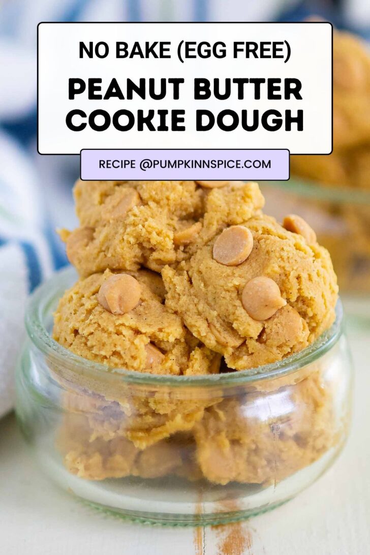 A small glass jar filled with scoops of peanut butter cookie dough topped with peanut butter chips. Text overlay says No Bake (Egg Free) Peanut Butter Cookie Dough. Recipe website @pumpkinnspice.com is listed.